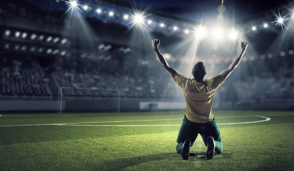 Fotbollsspelare som firar ett mål