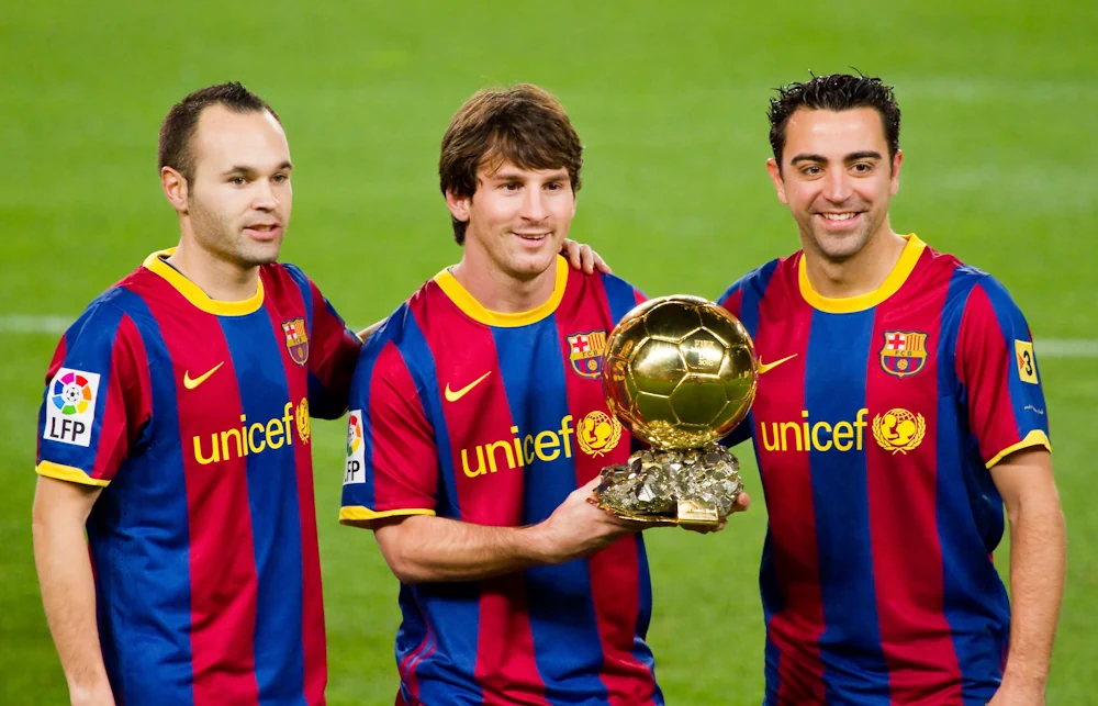 Xavi tillsammans med Lionel Messi och Andrés Iniesta